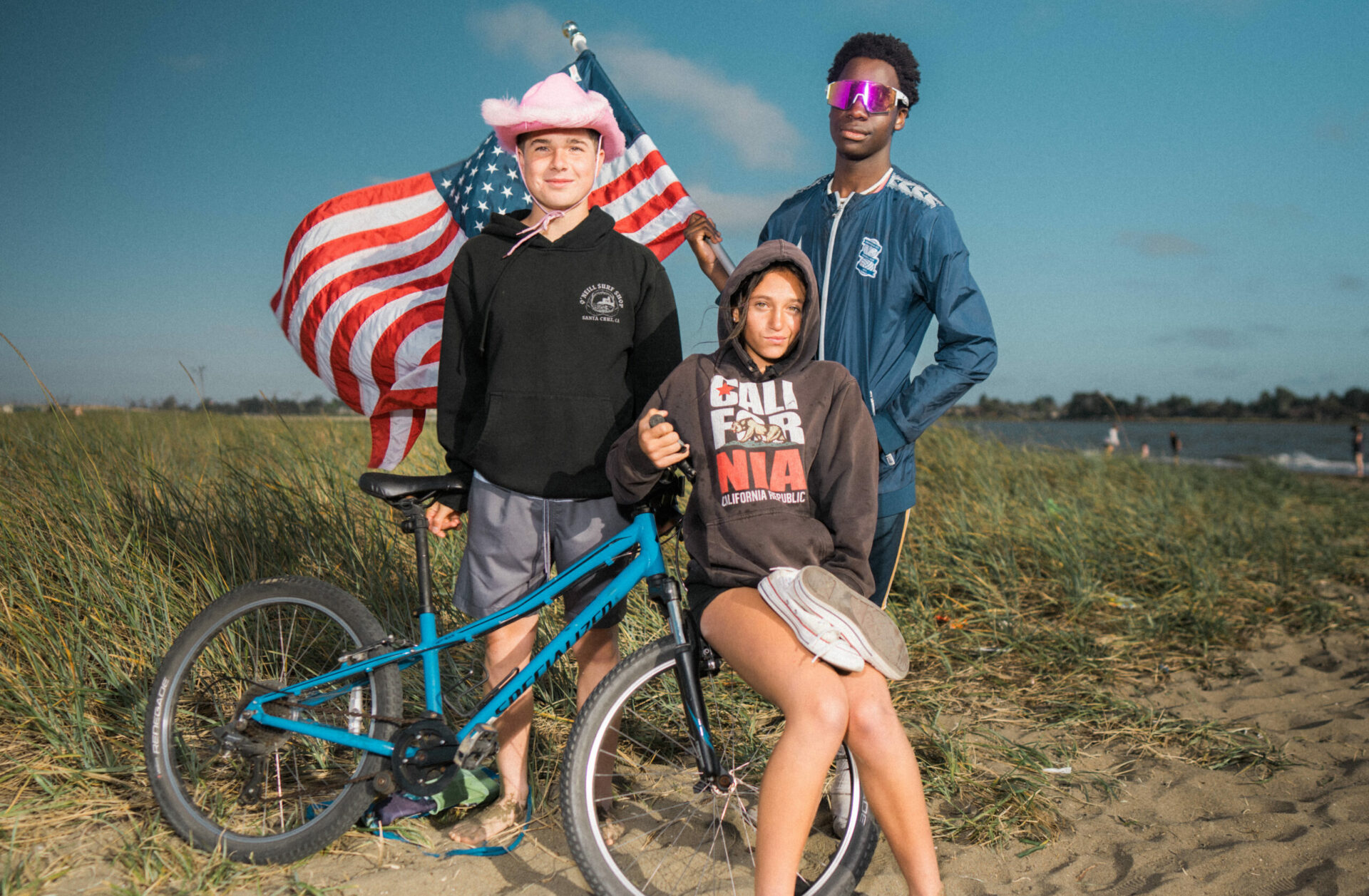 July 2024 As the political winds shift, we are reminded of the power and the promise of the young people we’ve handed a climate-changed world. In this patriotic summer beach shot from Alameda, we see California’s strong opinions, youth, transportation choices, and inclusivity. Photo: Maurice Ramirez