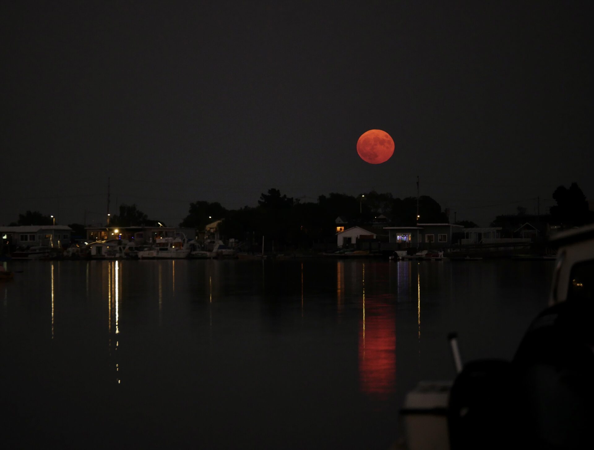 September 2023. The August Blue Moon, otherwise known as the Sturgeon Moon, taken from a dock on Corte Madera Creek in Larkspur, California by Lisa Strong. Due to fires in Northern California, smokey air gave the moon a brooding orange sheen, inspiring the photographer to suggest it be called the Fire Moon moving forward.