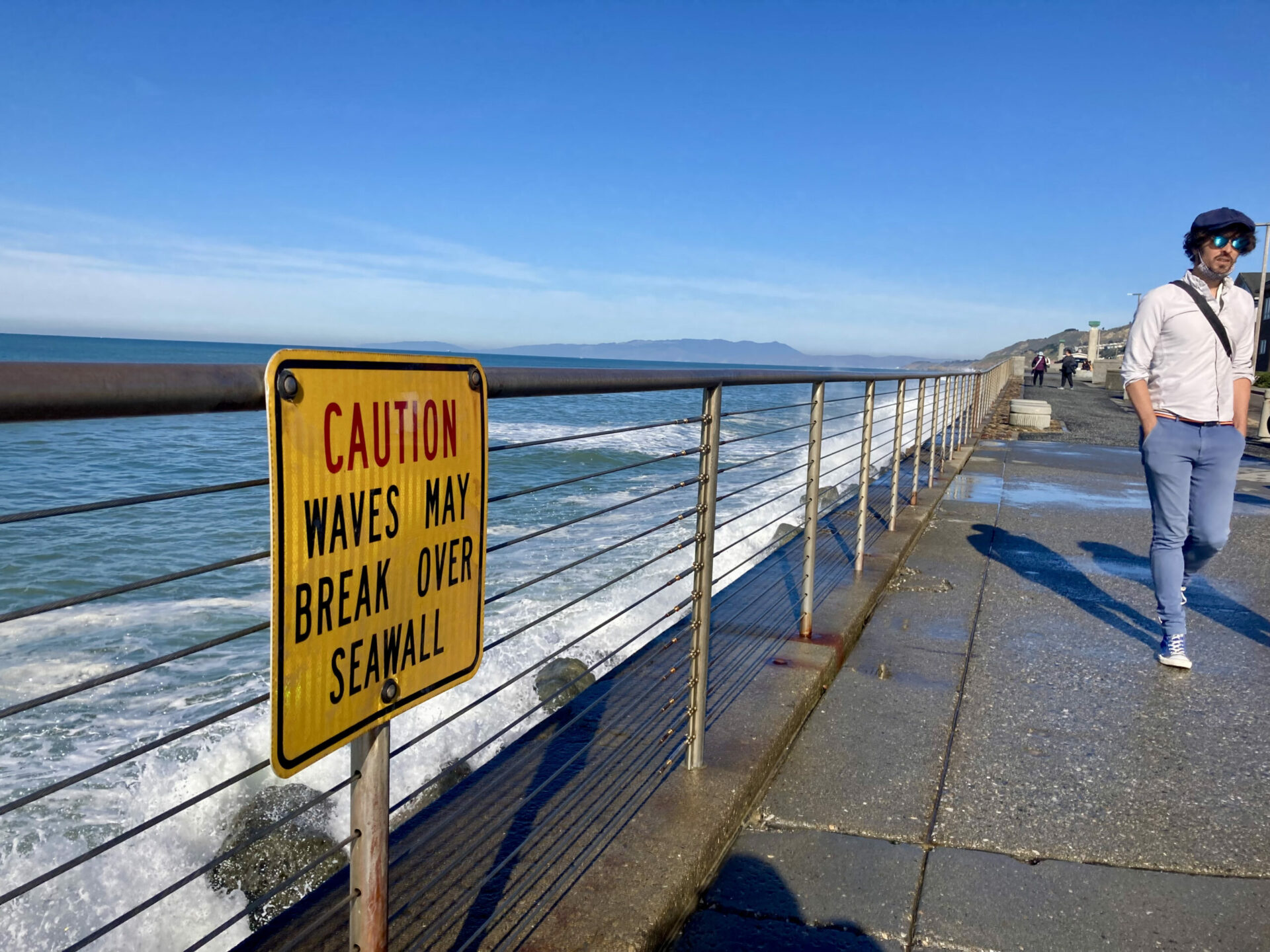 The houses behind this sidewalk in Pacifica, California are often sprayed by waves during high tide or surf. Photo: Sierra Garcia.