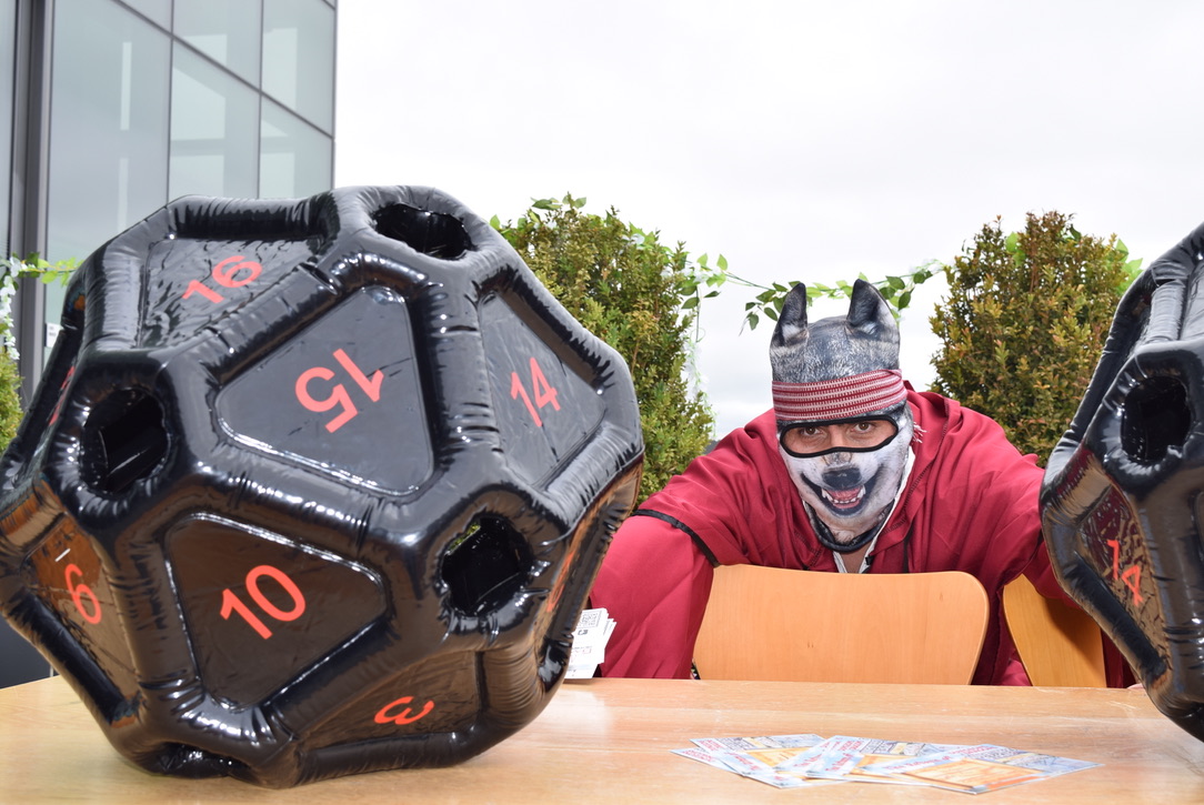 D&D animal character poses next to 20-sided dice that drives the game. Photo: Aiyana Washington.