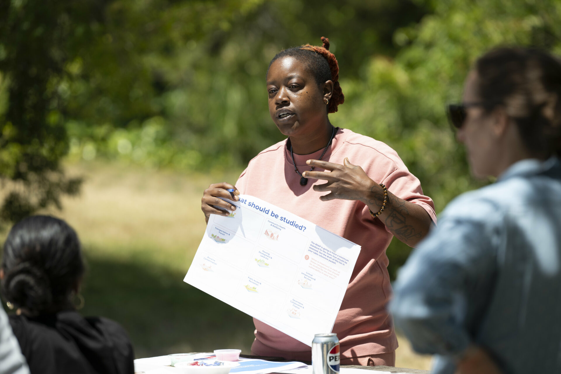 June 2024 At a June event, Oakland activist and consultant Keta Price explained to neighbors and residents gathered on the Richmond shore how sea level rise and coastal flooding could affect them in the future. Price’s firm Hood Planning is one of five community-based organizations partnering with the SF Bay Conservation and Planning Commission to mount an equitable, regional response to the flood threat. Photo Karl Nielsen
