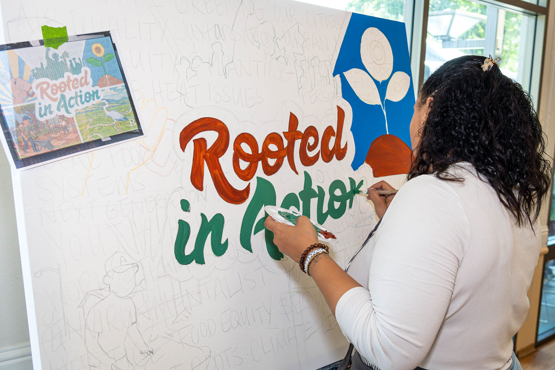 Sheree Rayford live painting an exclusive mural for the summit. Photo: Brianna Casanares/Greenbelt Alliance