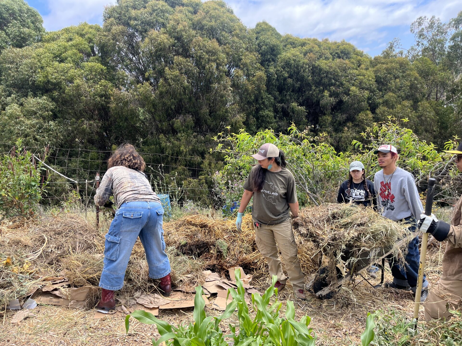 Building a base for the compost pile.