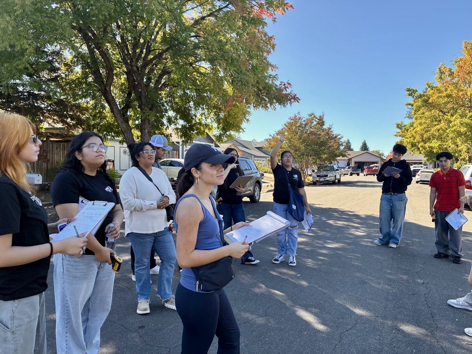 The youth advisory team debriefed with Cesar Estien after noting temperature variations at four nearby locations.
