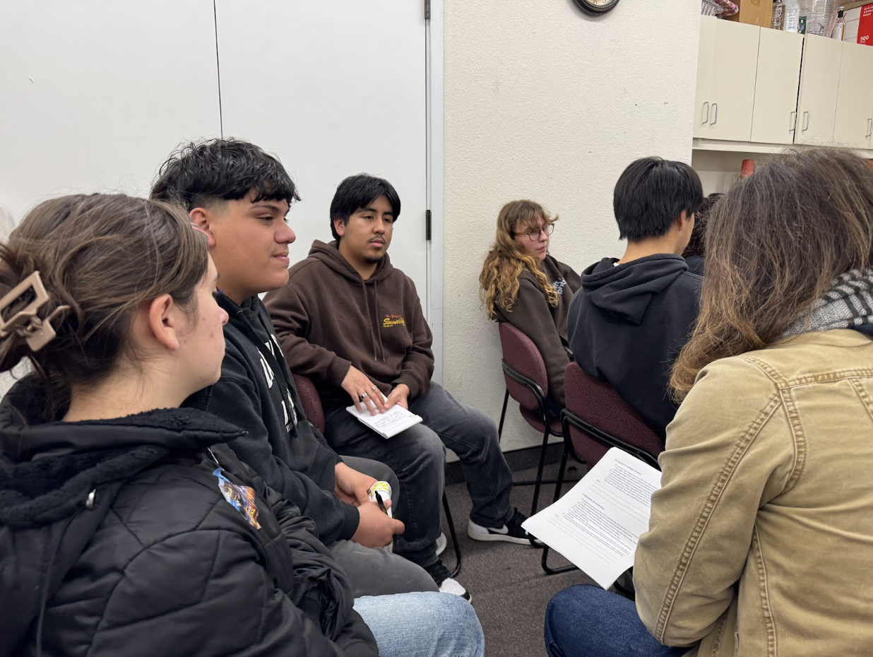 Sustainable Solano Community Meeting Six people sit in chairs at the Sustainable Solano meeting