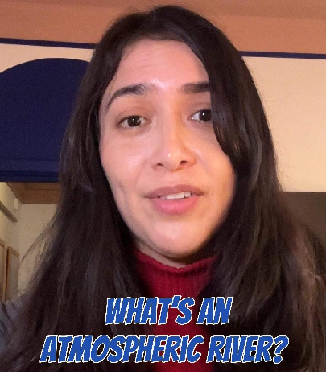 Photo of woman explaining what an atmospheric river is.
