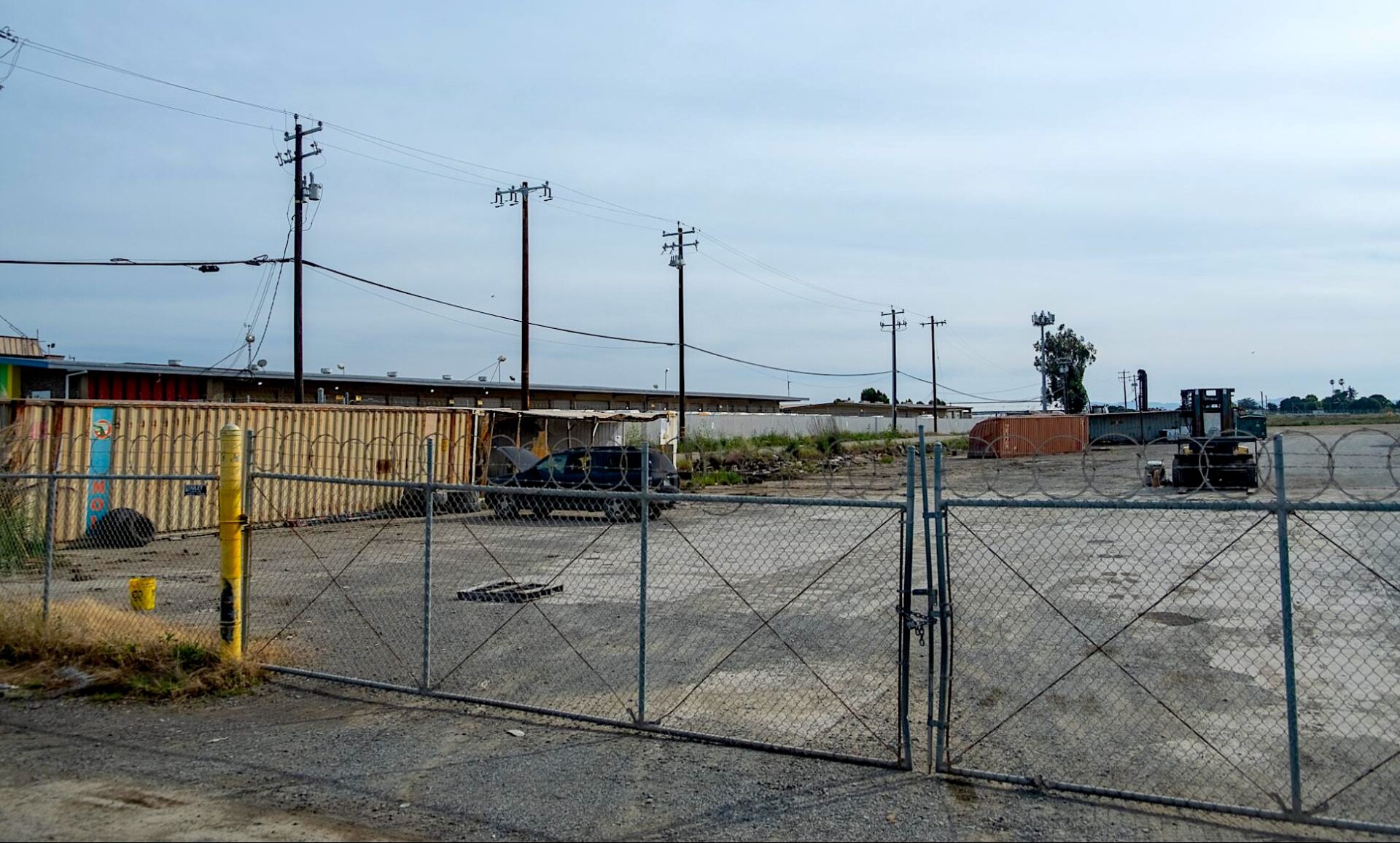 An empty lot behind a fence